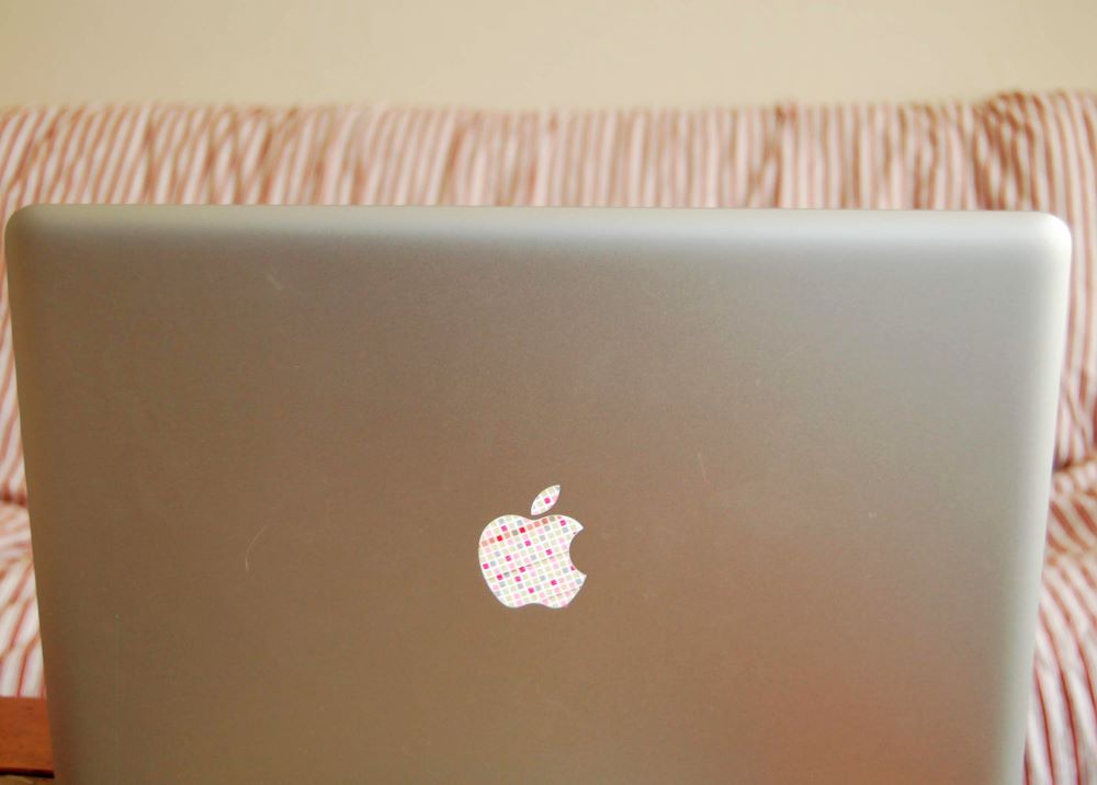 mac laptop with washi tape apple logo glowing