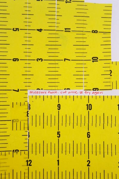 postcard-sized artwork of yellow measuring tape