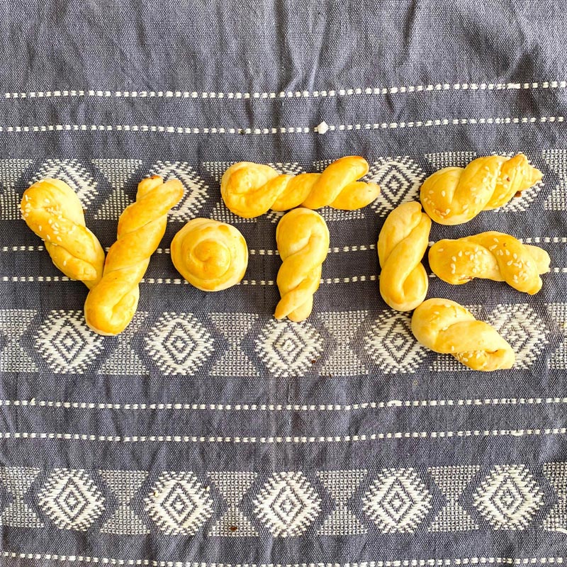 Koulourakia cookies arranged to spell the word vote