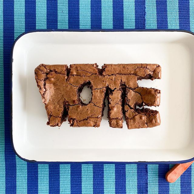 Loaf of brownie carved to read vote