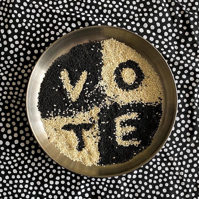 Black and white sesame seeds arranged in quadrants spelling vote