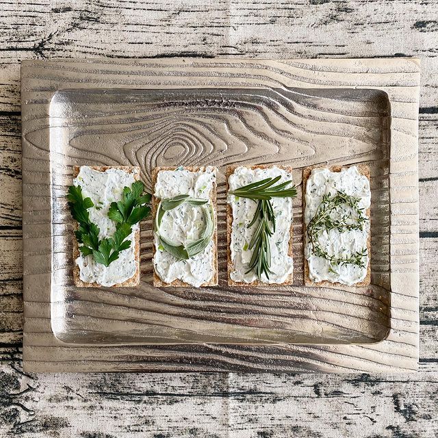 Parsley Sage Rosemary and Thyme herbs spelling vote on Wasa crackers with cream cheese spread