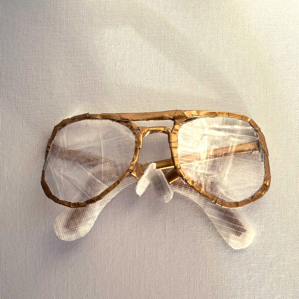 Gold aviator glasses made with duct tape and packing tape, folded