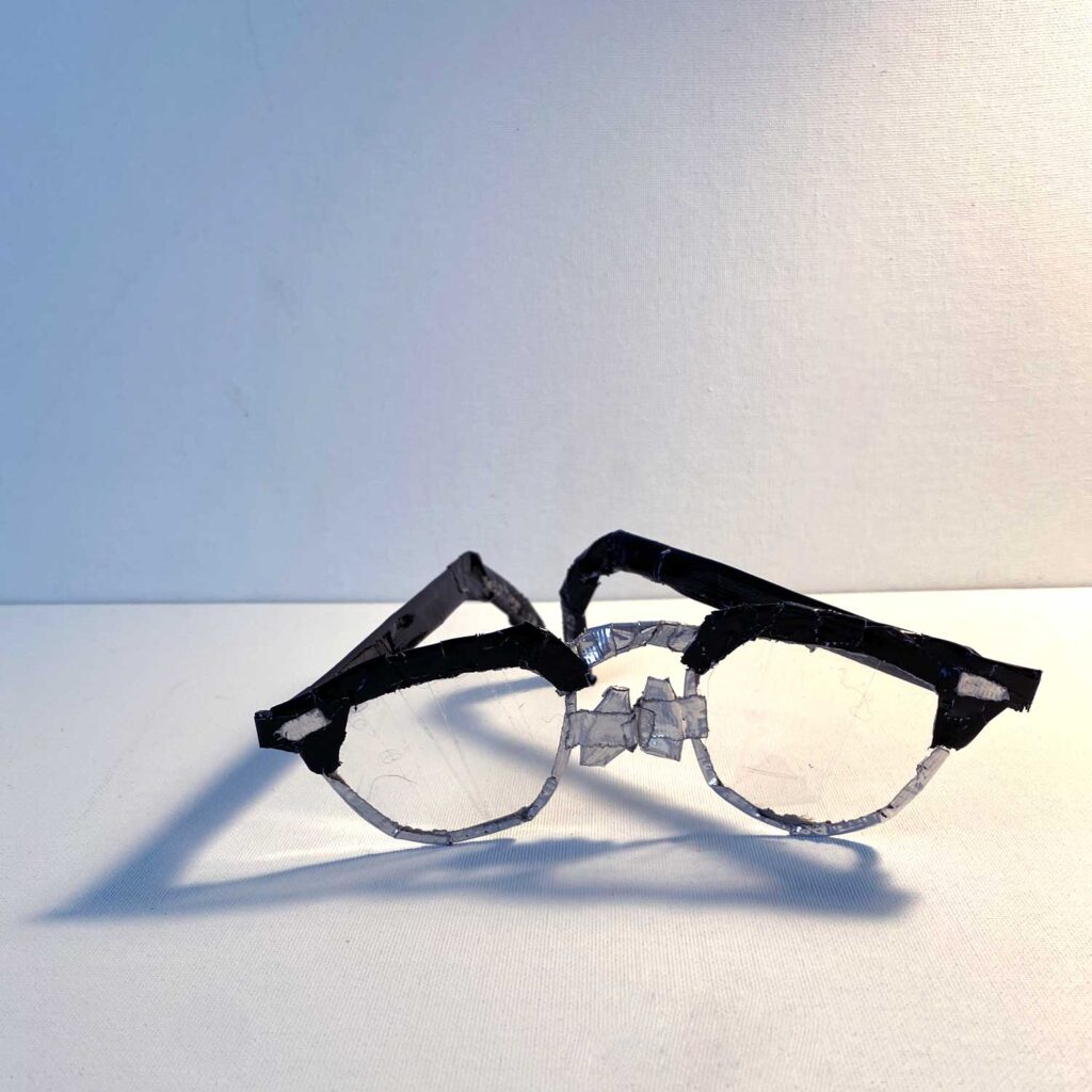 Horned half-rim glasses made with duct tape and packing tape, front view